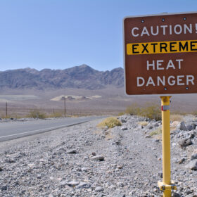 Sign in Death Valley National Park warning visitors of dangerous temperatures.